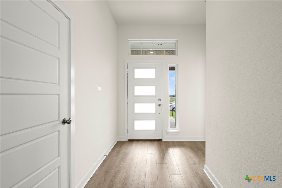 5102 Pollack Lane Belton, TX 76513 - Photo 6 of 30 a view of a hallway with wooden floor and closet