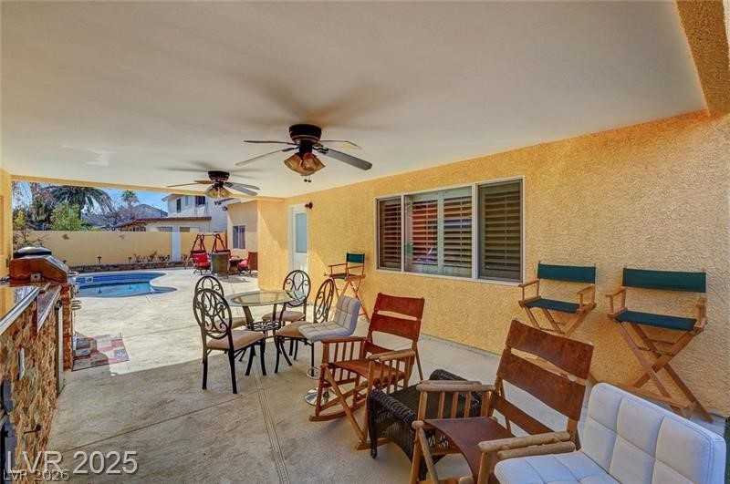 2410 Doherty Way Henderson, NV 89014 - Photo 59 of 63 View of patio with ceiling fan, a fenced backyard, and outdoor dining area