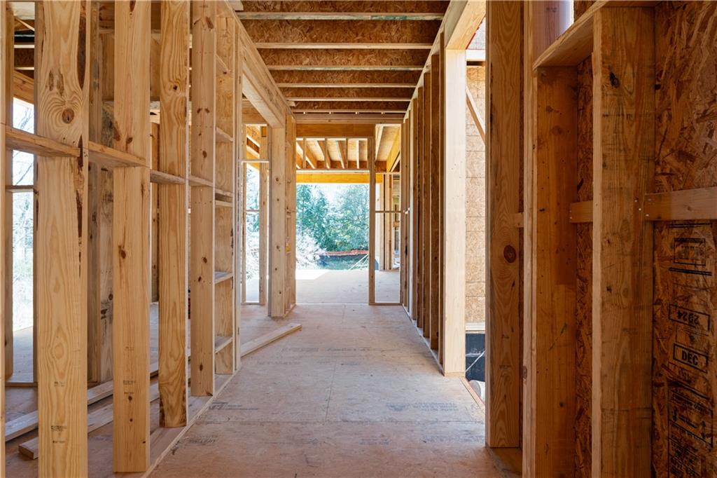 4957 Peachtree Dunwoody Road Sandy Springs, GA 30342 - Photo 16 of 54 a view of a hallway with wooden walls and windows
