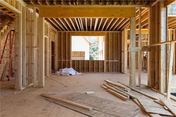 a view of a hallway with wooden door and hallway