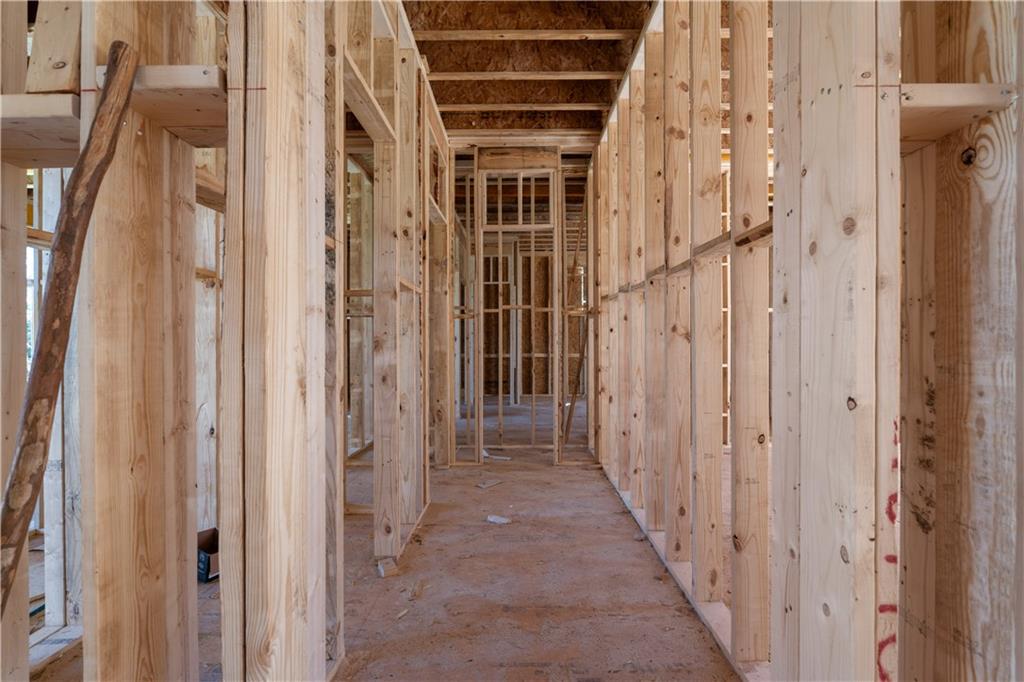 4957 Peachtree Dunwoody Road Sandy Springs, GA 30342 - Photo 24 of 54 a view of a hallway with wooden door and hallway