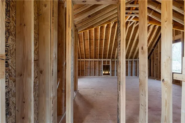 a view of entryway with wooden floor and door