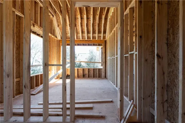 a view of a porch with wooden floor and fence