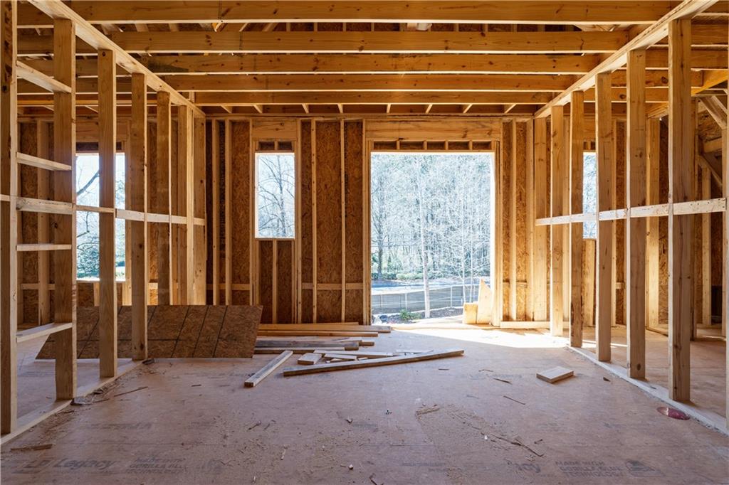 4957 Peachtree Dunwoody Road Sandy Springs, GA 30342 - Photo 45 of 54 a view of an empty room with wooden floor and a window