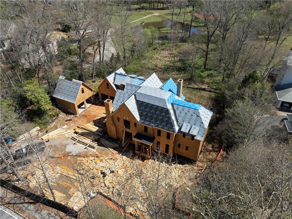 4957 Peachtree Dunwoody Road Sandy Springs, GA 30342 - Photo 53 of 54 an aerial view of a house with wooden fence