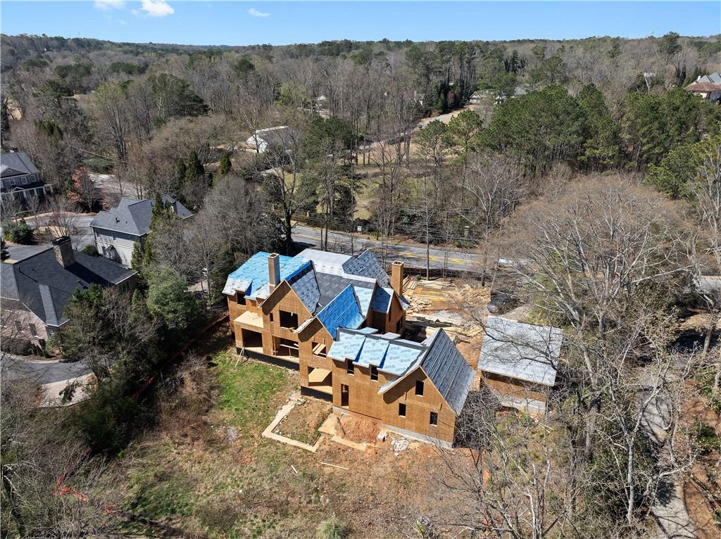 4957 Peachtree Dunwoody Road Sandy Springs, GA 30342 - Photo 7 of 54 an aerial view of a house with a yard