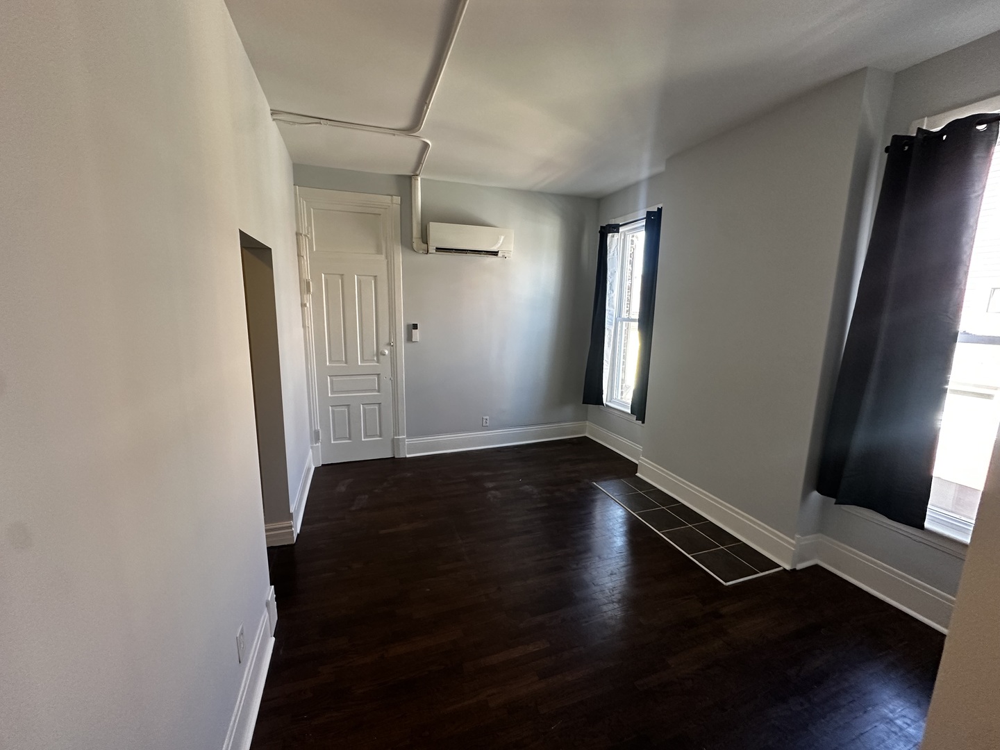 1028 South State Street, Unit 2 Lockport, IL 60441 - Photo 6 of 6 an empty room with wooden floor and windows