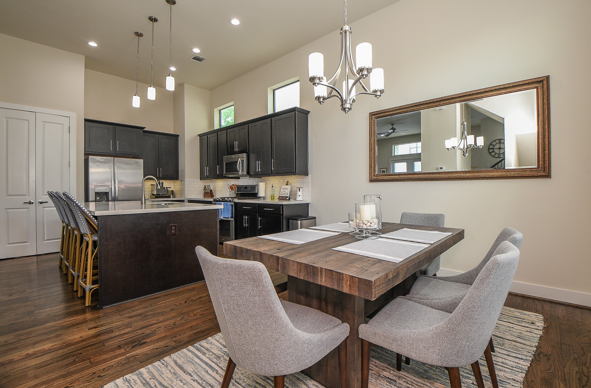 1204 Fowler Street Houston, TX 77007 - Photo 5 of 23 a view of a dining room with furniture a chandelier and wooden floor