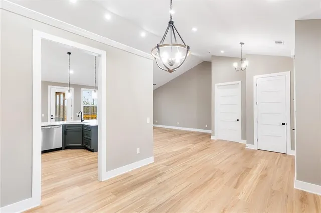 a spacious bedroom with a bed and a window