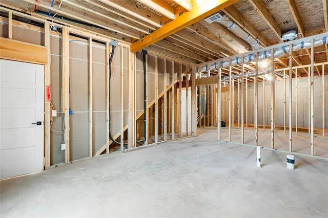 a view of an entryway with wooden floor and windows