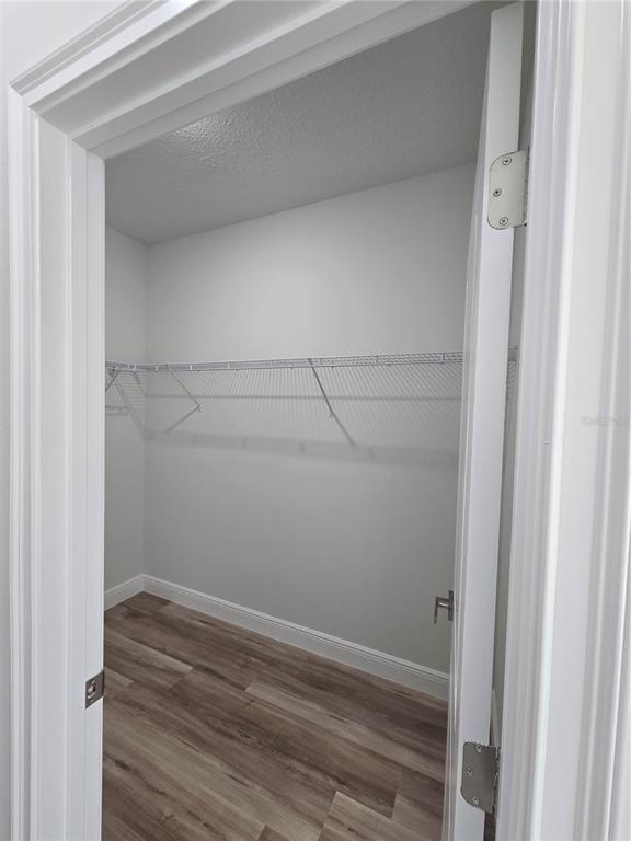 3862 Southwest 147th Street Ocala, FL 34473 - Photo 11 of 29 a view of a room with racks on the wall
