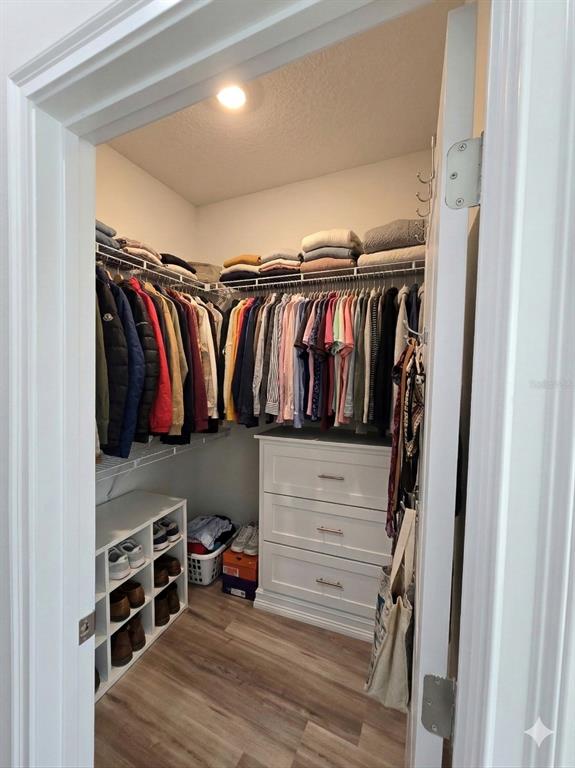3862 Southwest 147th Street Ocala, FL 34473 - Photo 12 of 29 a view of walk in closet with clothes and shoes