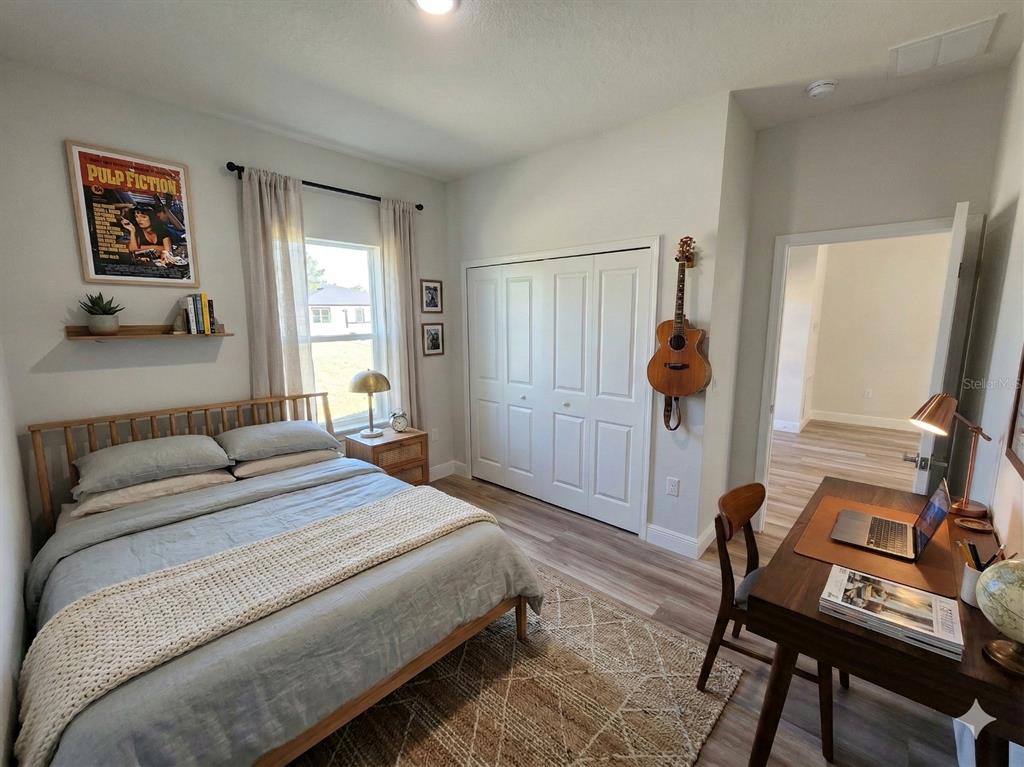 3862 Southwest 147th Street Ocala, FL 34473 - Photo 16 of 29 a bedroom with a bed and a window