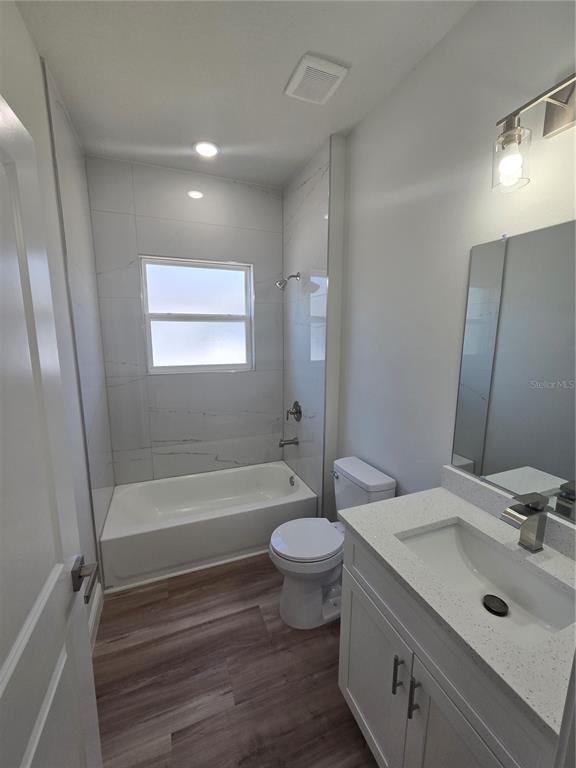 3862 Southwest 147th Street Ocala, FL 34473 - Photo 17 of 29 a bathroom with a sink a toilet a tub and shower