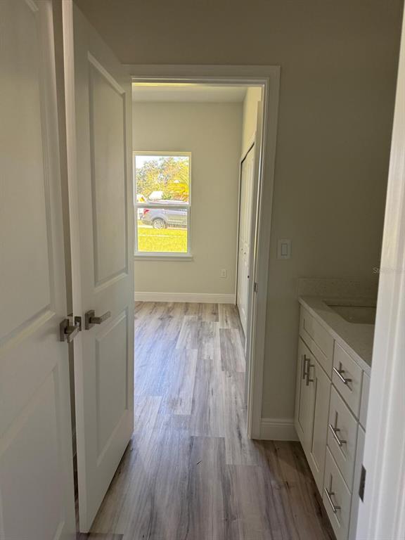 3862 Southwest 147th Street Ocala, FL 34473 - Photo 20 of 29 a view of a hallway view with wooden floor and staircase