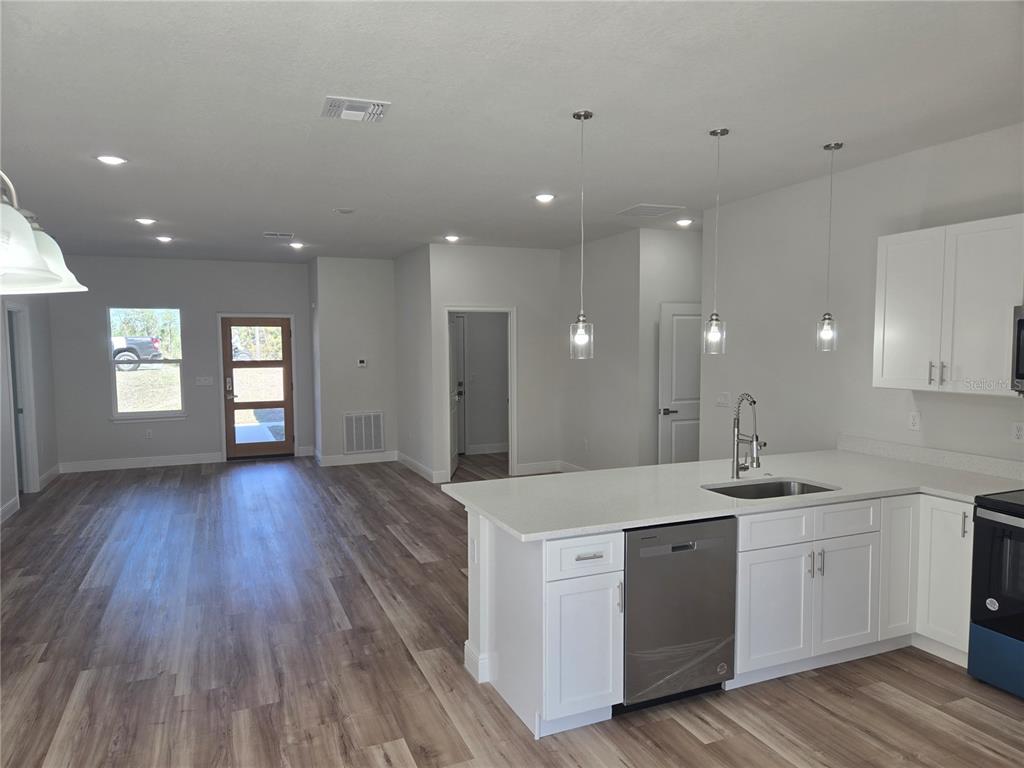 3862 Southwest 147th Street Ocala, FL 34473 - Photo 5 of 29 a view of kitchen with sink and wooden floor