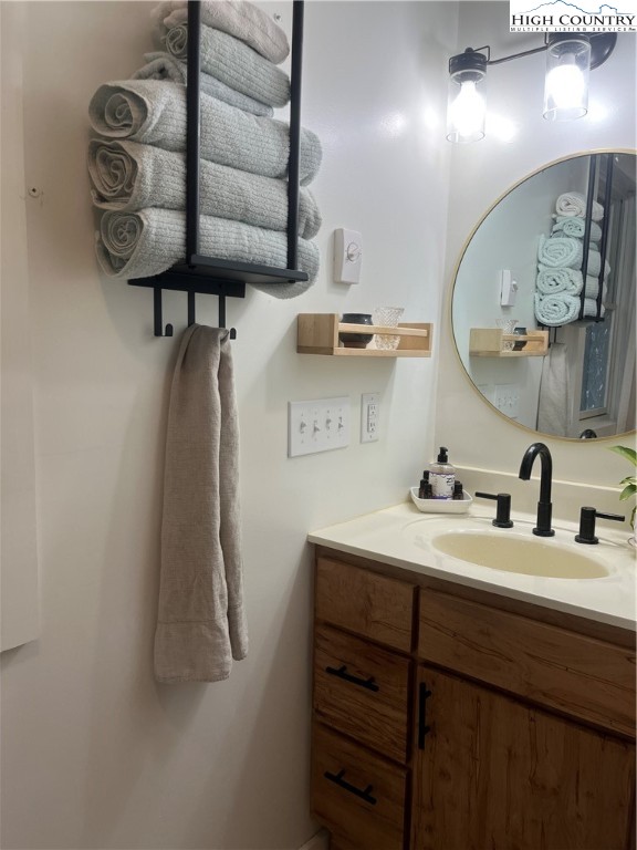 80 Pine Valley Road Newland, NC 28657 - Photo 12 of 12 a bathroom with a sink vanity and a mirror