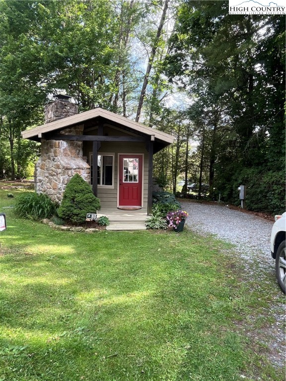 80 Pine Valley Road Newland, NC 28657 - Photo 2 of 12 a view of backyard with a barn and large trees