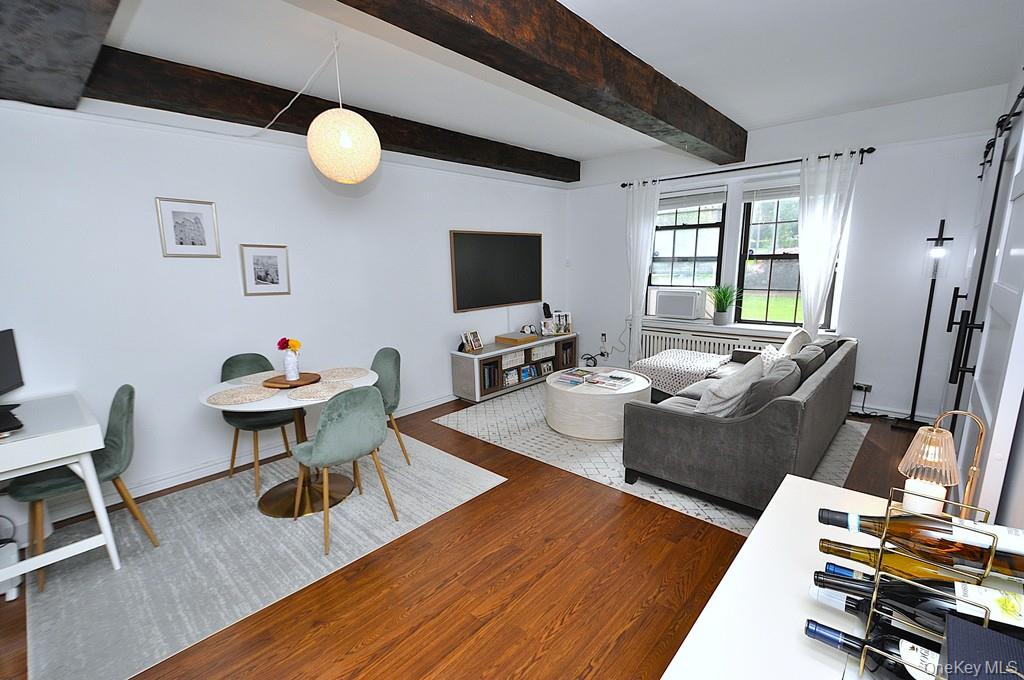 192 Garth Road, Unit TP Scarsdale, NY 10583 - Photo 7 of 43 Designed for both everyday living and effortless entertaining, the spacious living room flows seamlessly into a formal dining room that offers remarkable flexibility as a home office, den, or potential third bedroom.