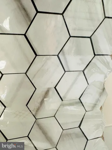 a picture of a bathroom with a shower and a mirror