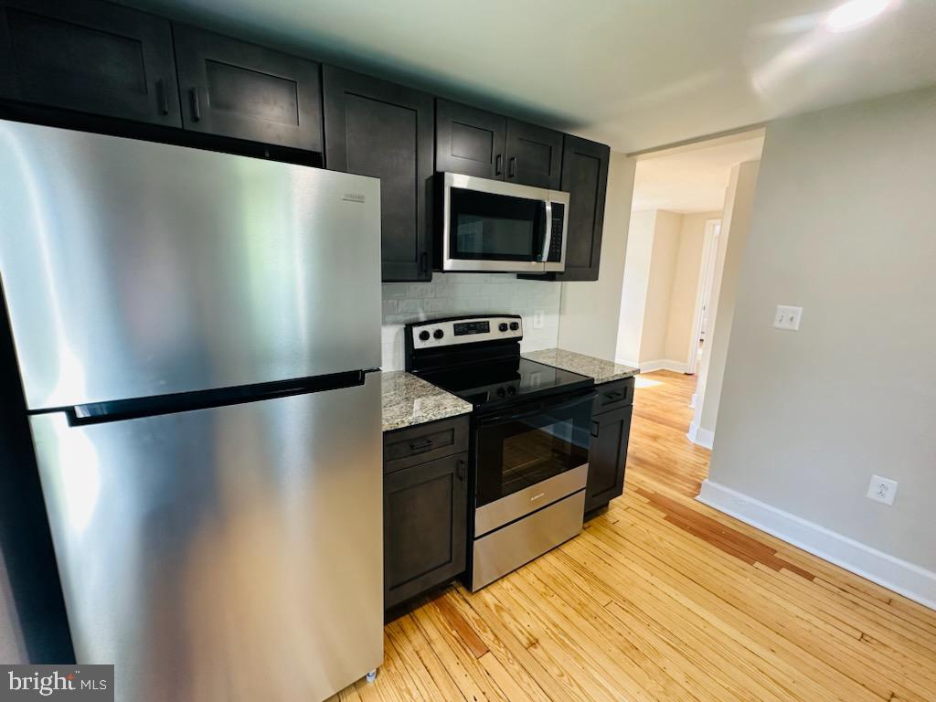9 East Poplar Street Funkstown, MD 21734 - Photo 16 of 17 a metallic refrigerator freezer sitting in a kitchen