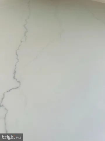 a close up of a white marble wall