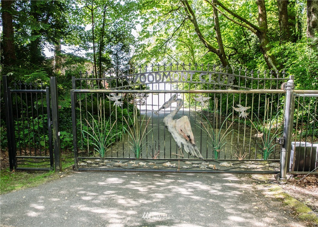 731 Woodmont Beach Road South Des Moines, WA 98198 - Photo 20 of 40 a backyard of a house with lots of plants and trees