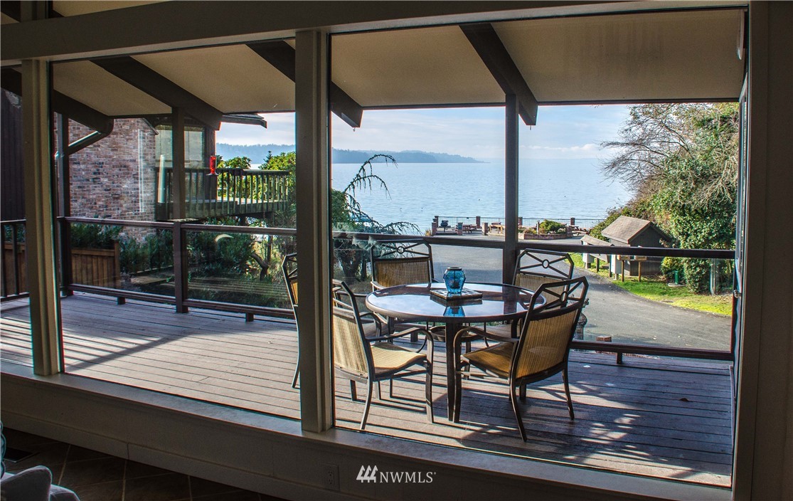731 Woodmont Beach Road South Des Moines, WA 98198 - Photo 3 of 40 a view of a living room with a table and chairs