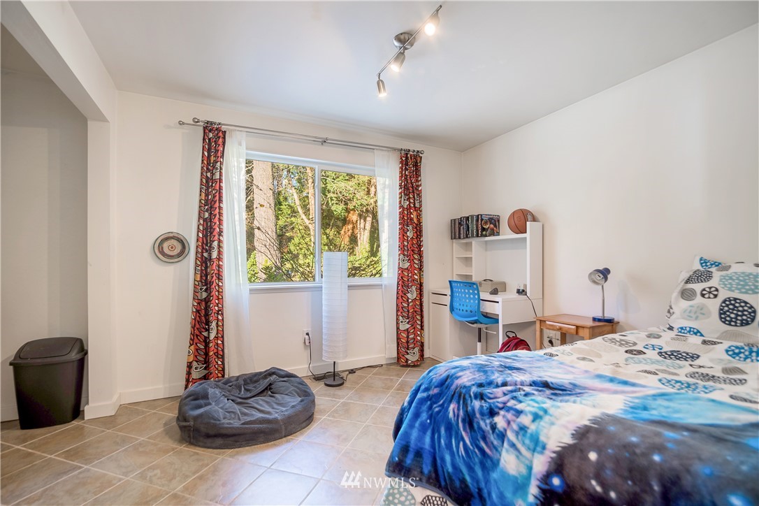 731 Woodmont Beach Road South Des Moines, WA 98198 - Photo 26 of 40 a bed room with a bed and a window