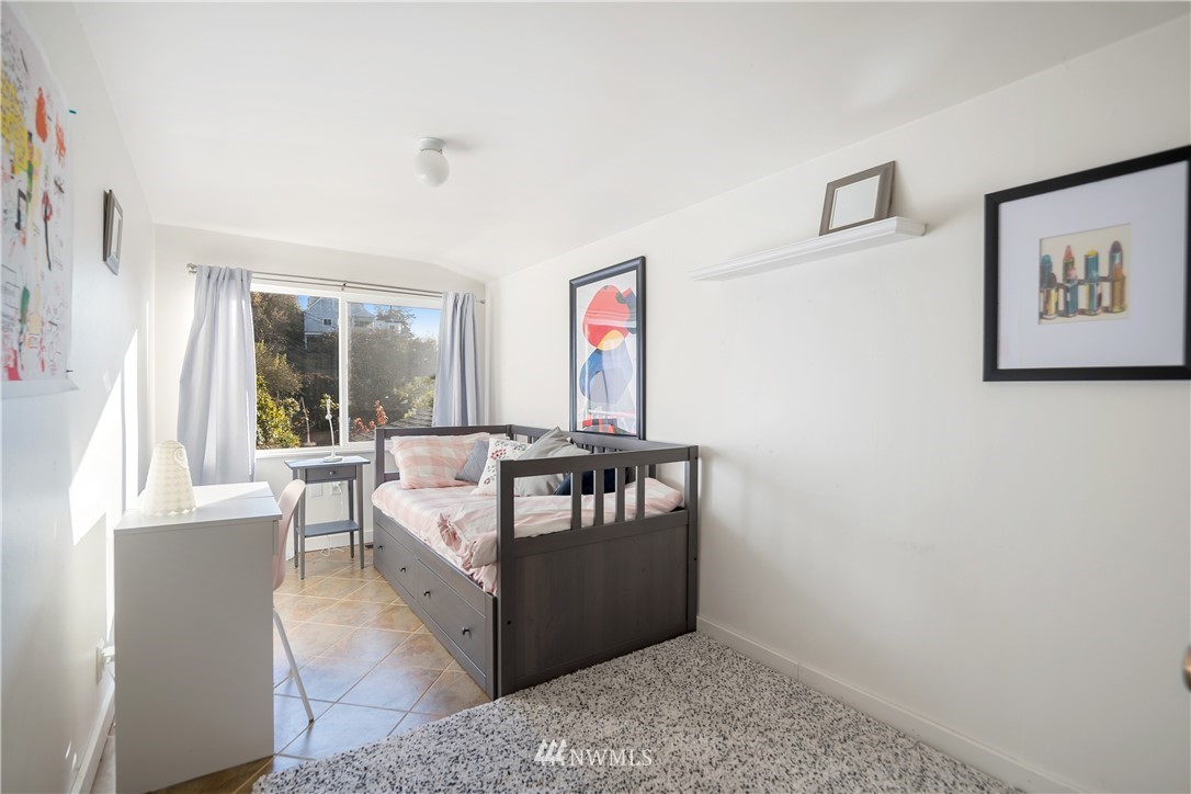 731 Woodmont Beach Road South Des Moines, WA 98198 - Photo 27 of 40 a living room with furniture and a window