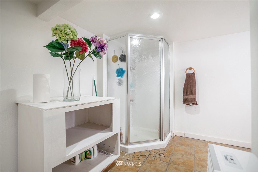 731 Woodmont Beach Road South Des Moines, WA 98198 - Photo 30 of 40 a vase of flowers sitting on a table