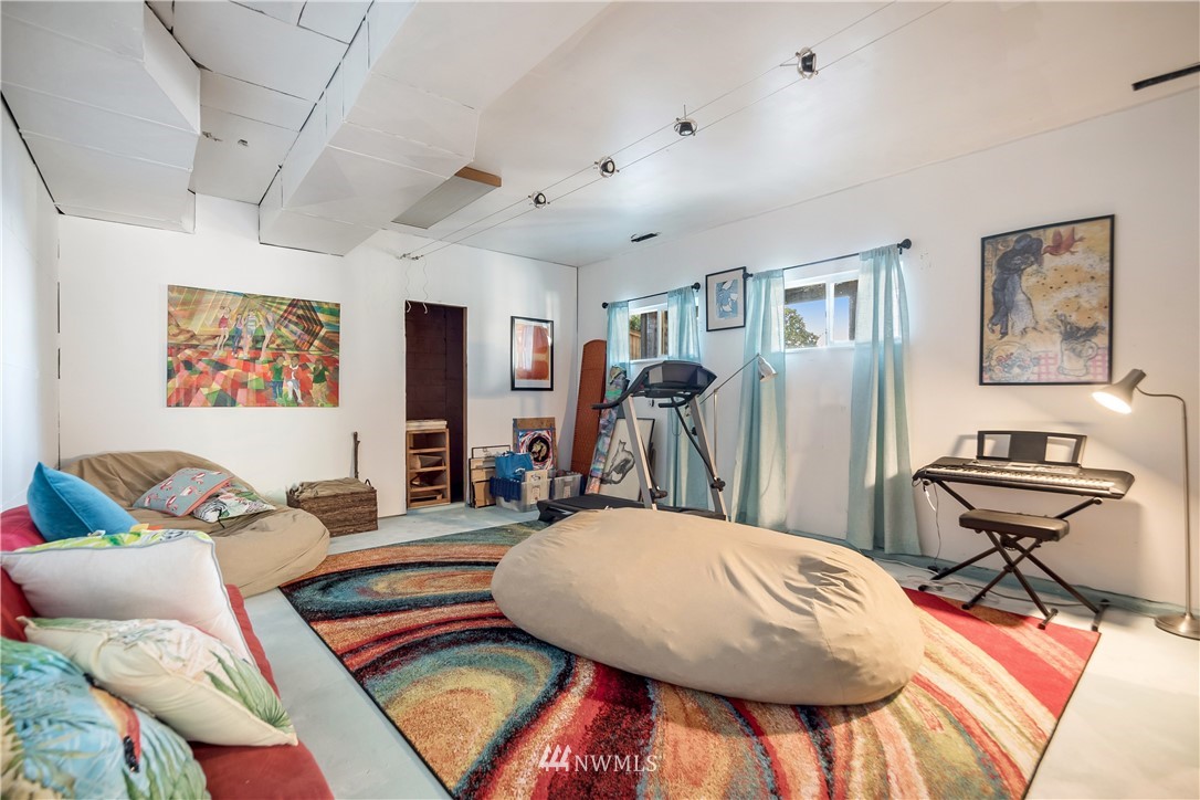 731 Woodmont Beach Road South Des Moines, WA 98198 - Photo 31 of 40 a bedroom with furniture and a wooden floor