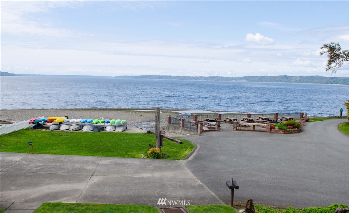 731 Woodmont Beach Road South Des Moines, WA 98198 - Photo 38 of 40 a view of a backyard with plants and bench