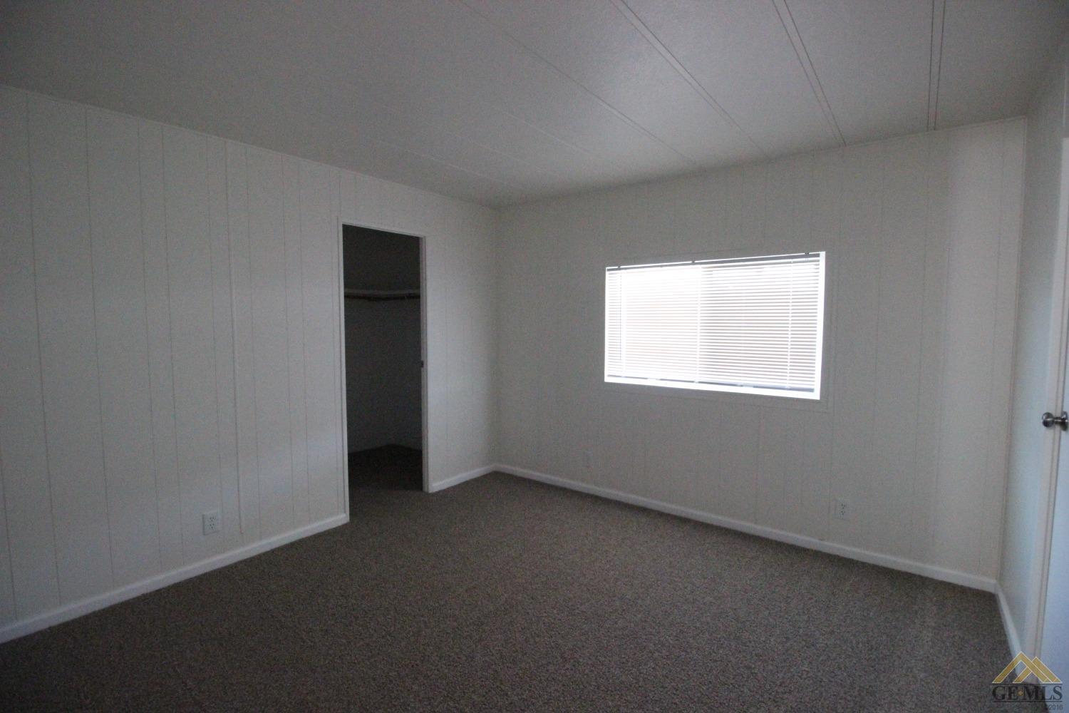 Undisclosed Address Bakersfield, CA 93308 - Photo 18 of 28 an empty room with a window