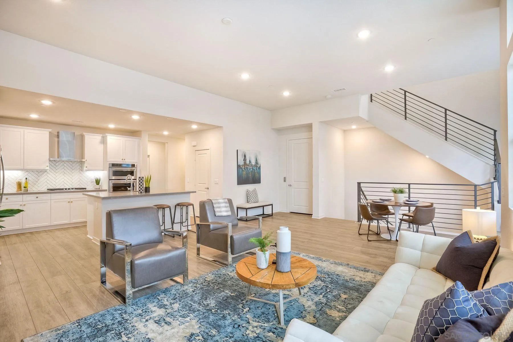 2040 Bravo Loop, Unit 4 Chula Vista, CA 91915 - Photo 2 of 25 a living room with furniture and kitchen view