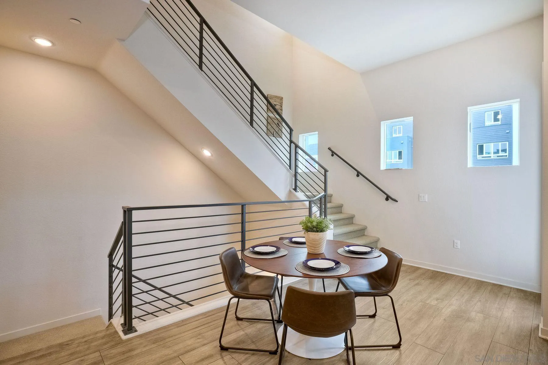 2040 Bravo Loop, Unit 4 Chula Vista, CA 91915 - Photo 21 of 25 a view of a dining room with furniture and wooden floor