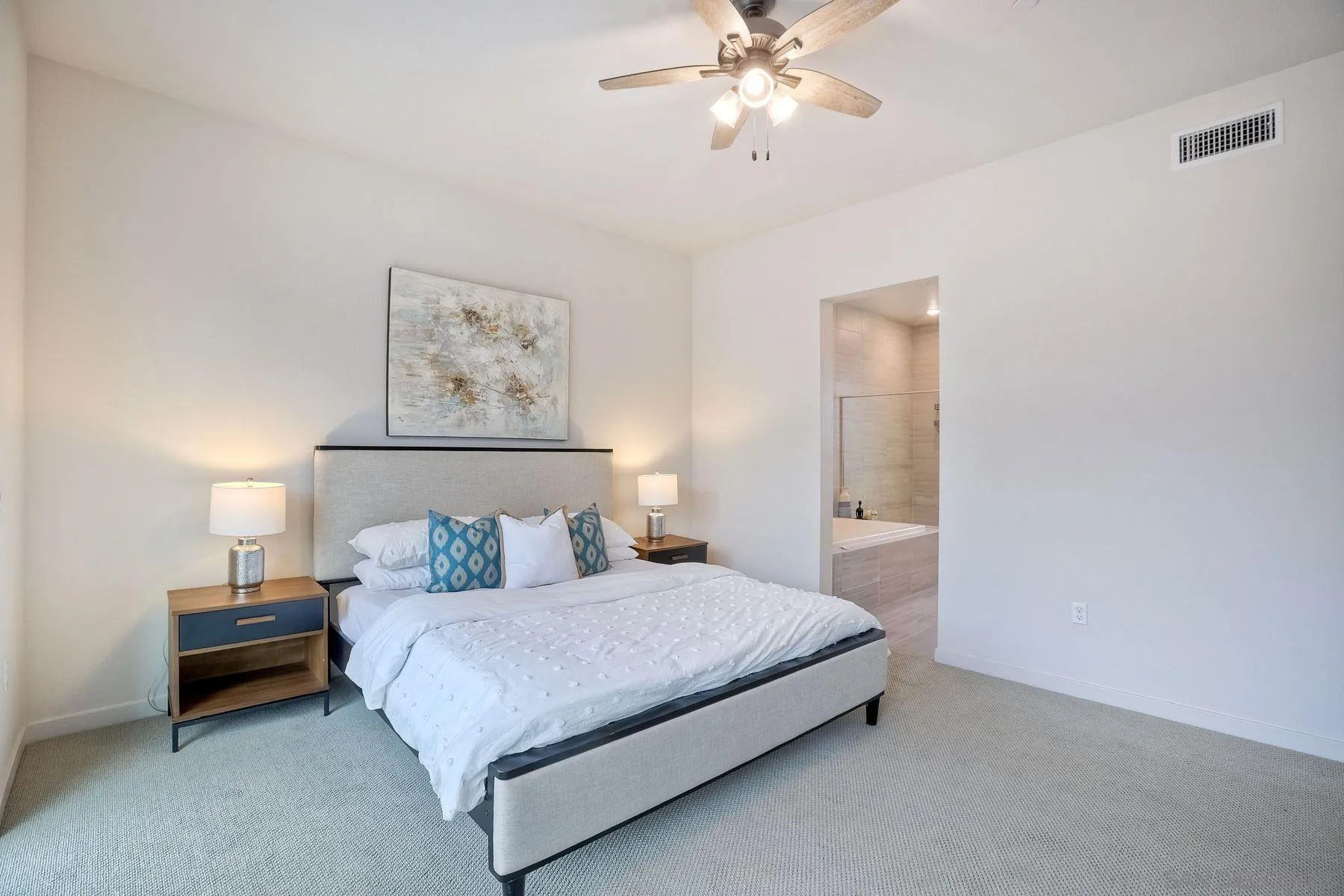 2040 Bravo Loop, Unit 4 Chula Vista, CA 91915 - Photo 10 of 25 a bedroom with a bed and a chandelier