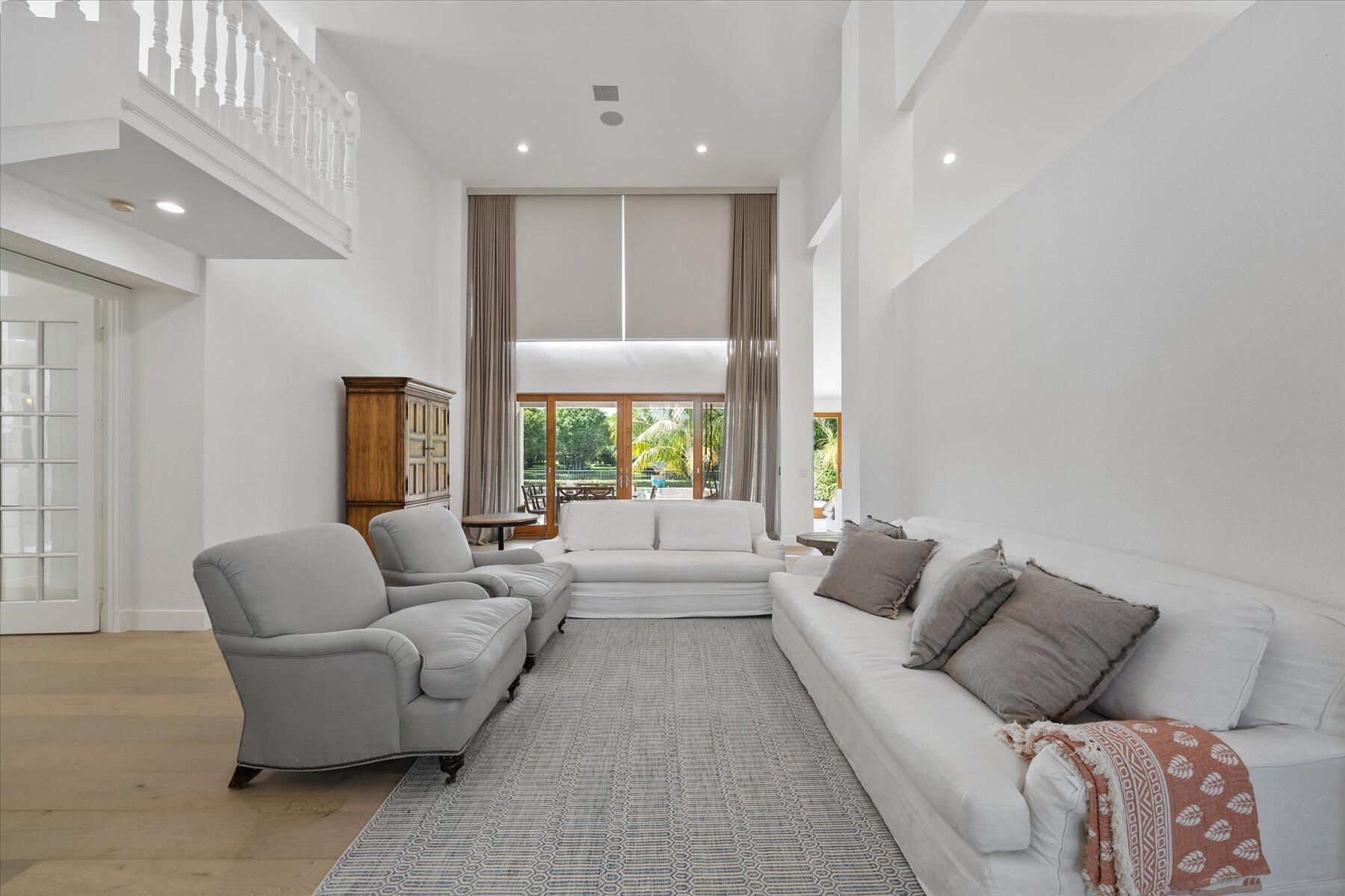 2821 Bent Cypress Road Wellington, FL 33414 - Photo 11 of 64 a living room with furniture and a large window