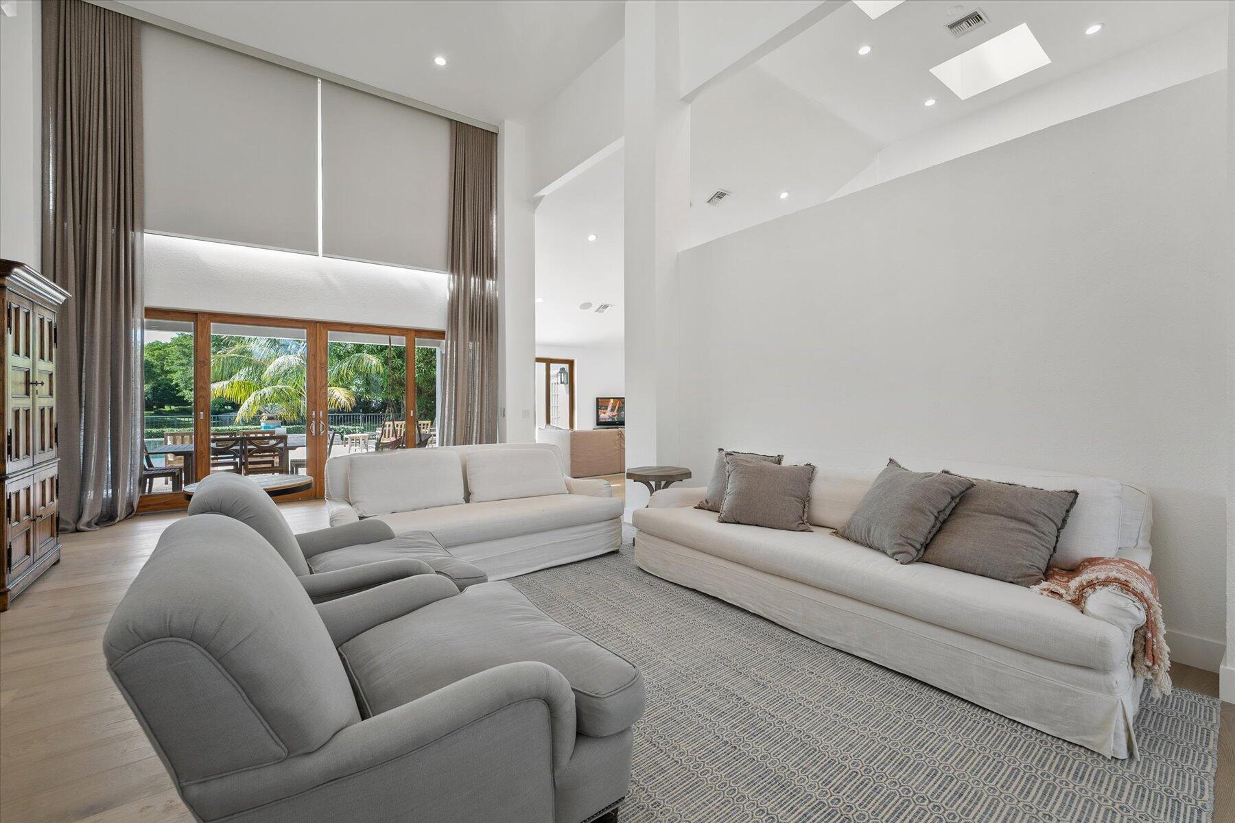 2821 Bent Cypress Road Wellington, FL 33414 - Photo 13 of 64 a living room with furniture and a large window