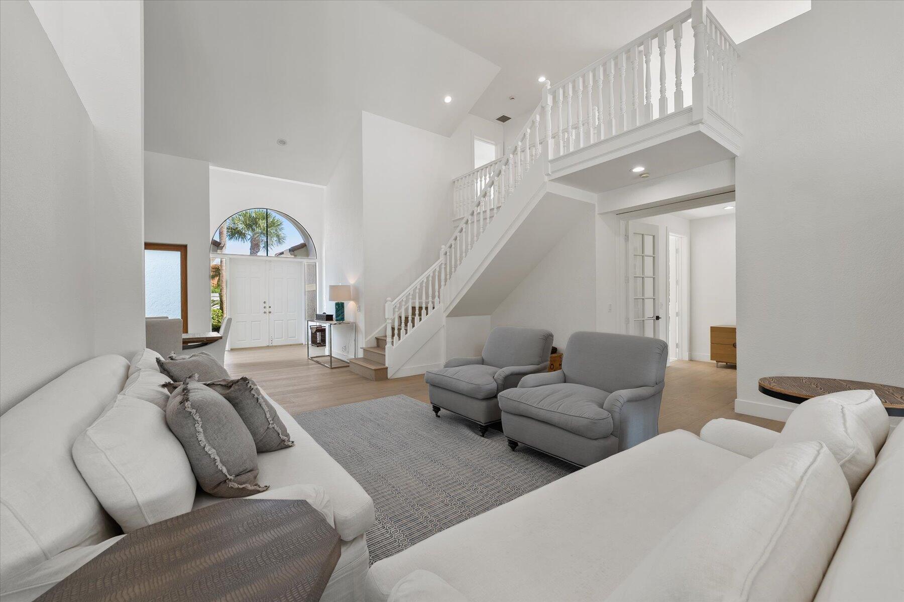 2821 Bent Cypress Road Wellington, FL 33414 - Photo 15 of 64 a living room with furniture and a chandelier