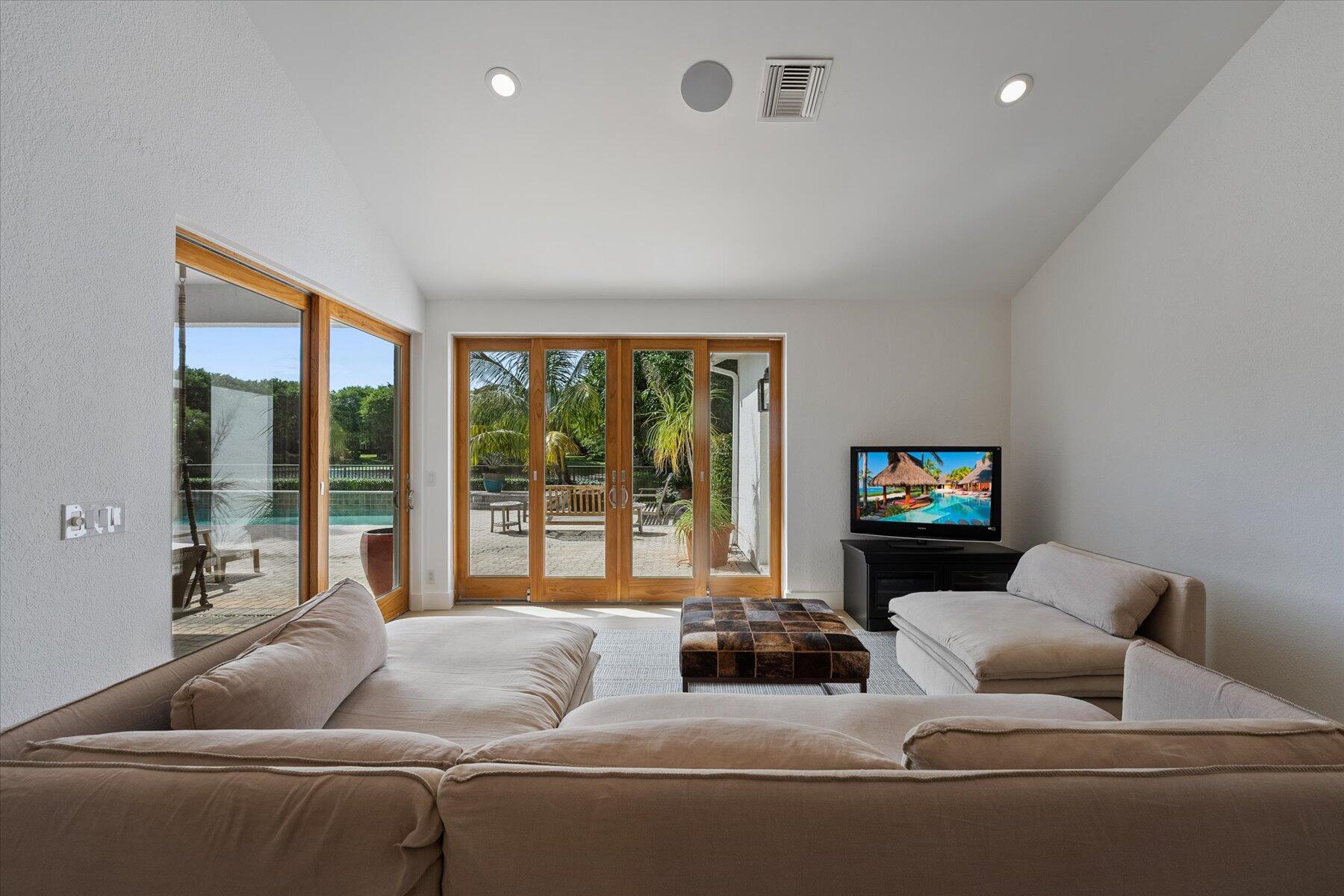 2821 Bent Cypress Road Wellington, FL 33414 - Photo 21 of 64 a living room with furniture and a flat screen tv