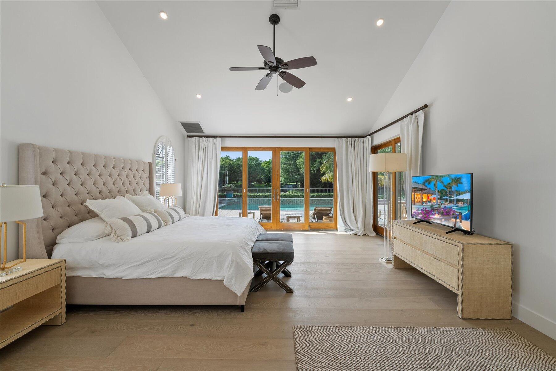 2821 Bent Cypress Road Wellington, FL 33414 - Photo 23 of 64 a living room with furniture and a flat screen tv