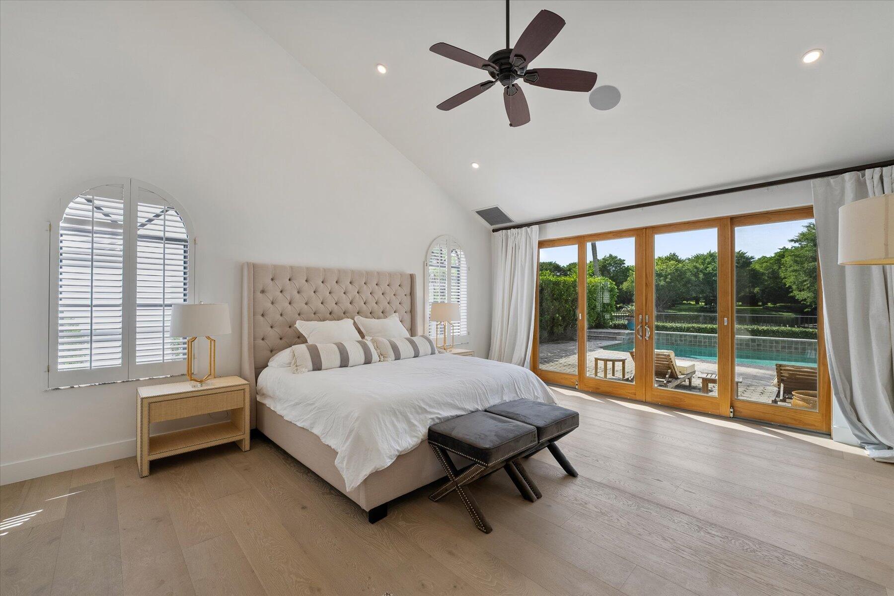 2821 Bent Cypress Road Wellington, FL 33414 - Photo 24 of 64 a bedroom with a bed and a large window