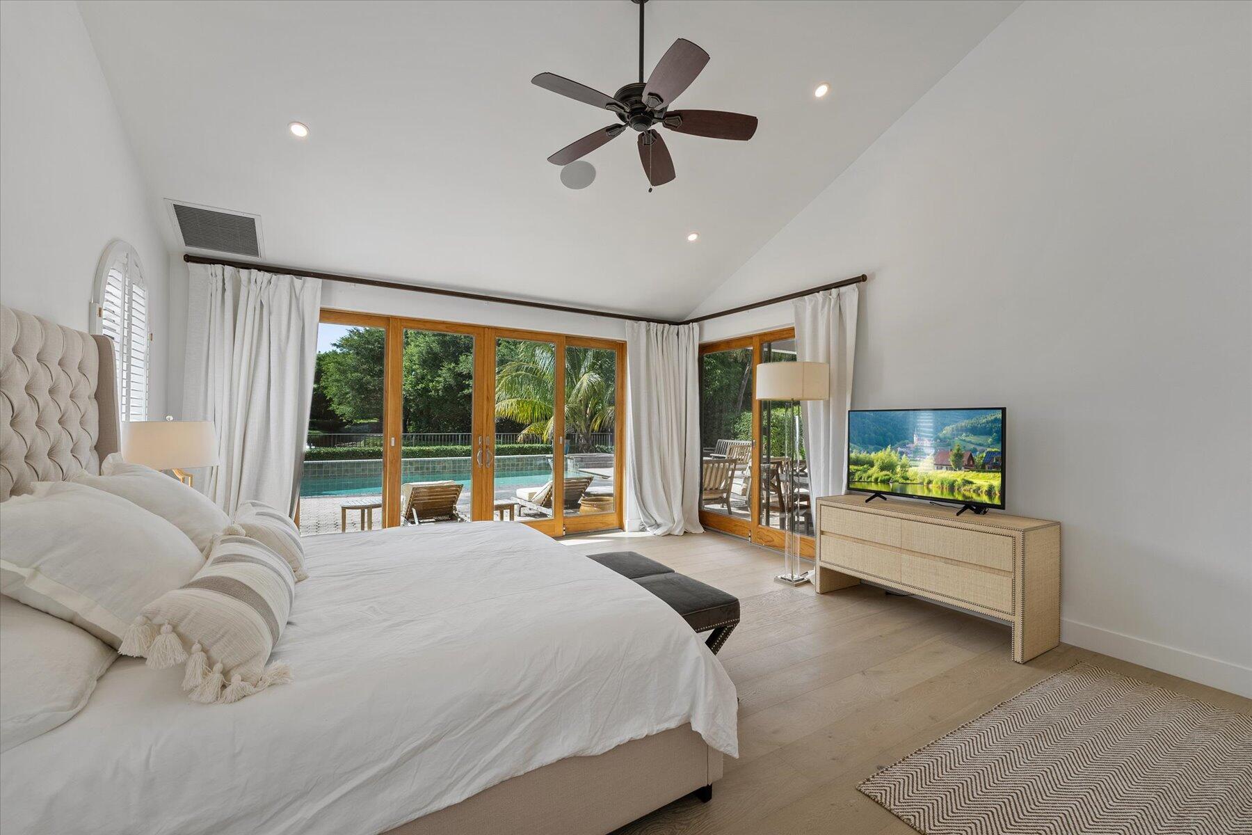 2821 Bent Cypress Road Wellington, FL 33414 - Photo 25 of 64 a bedroom with a bed and a large window