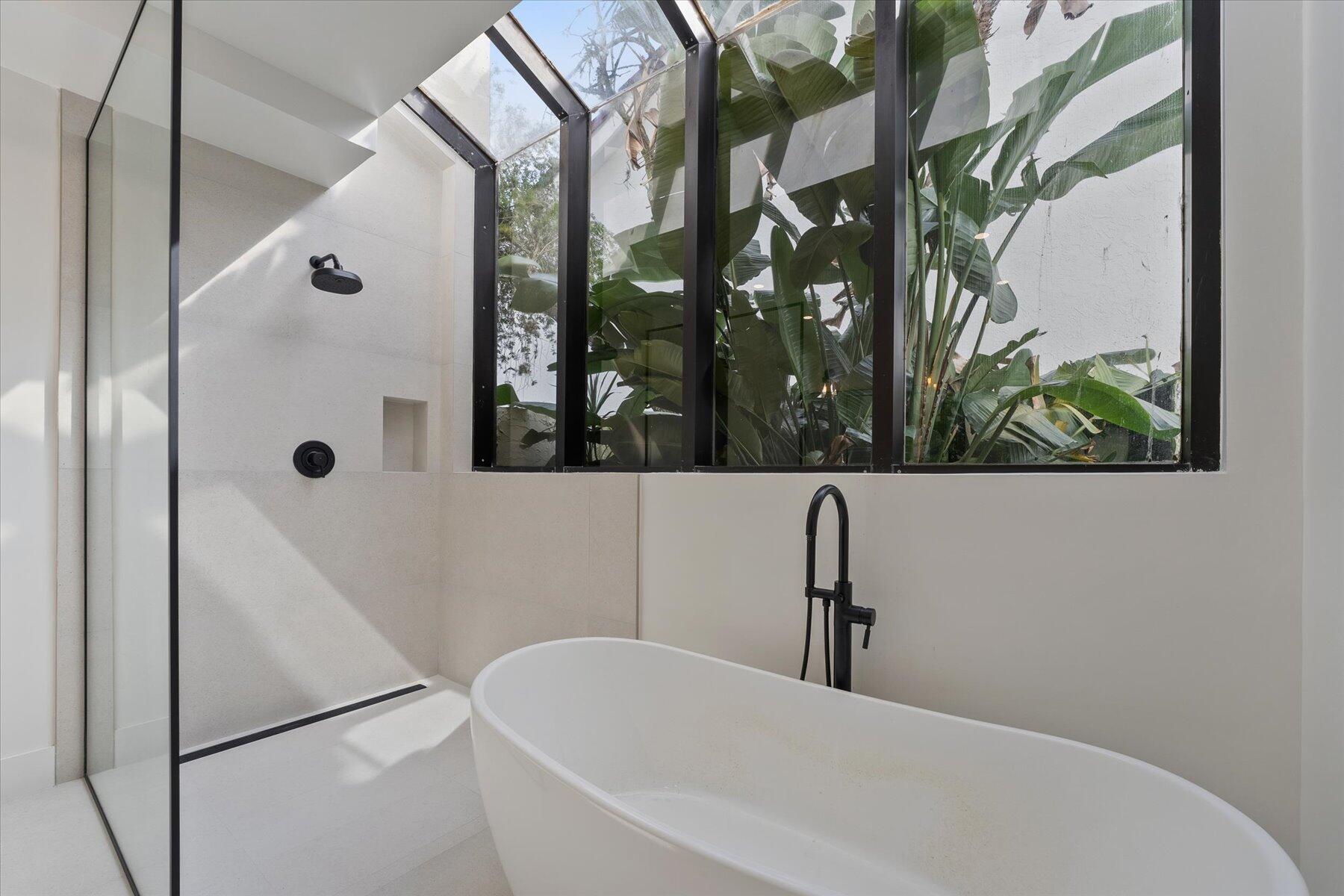 2821 Bent Cypress Road Wellington, FL 33414 - Photo 31 of 64 a bathroom with a sink and mirror with bathtub