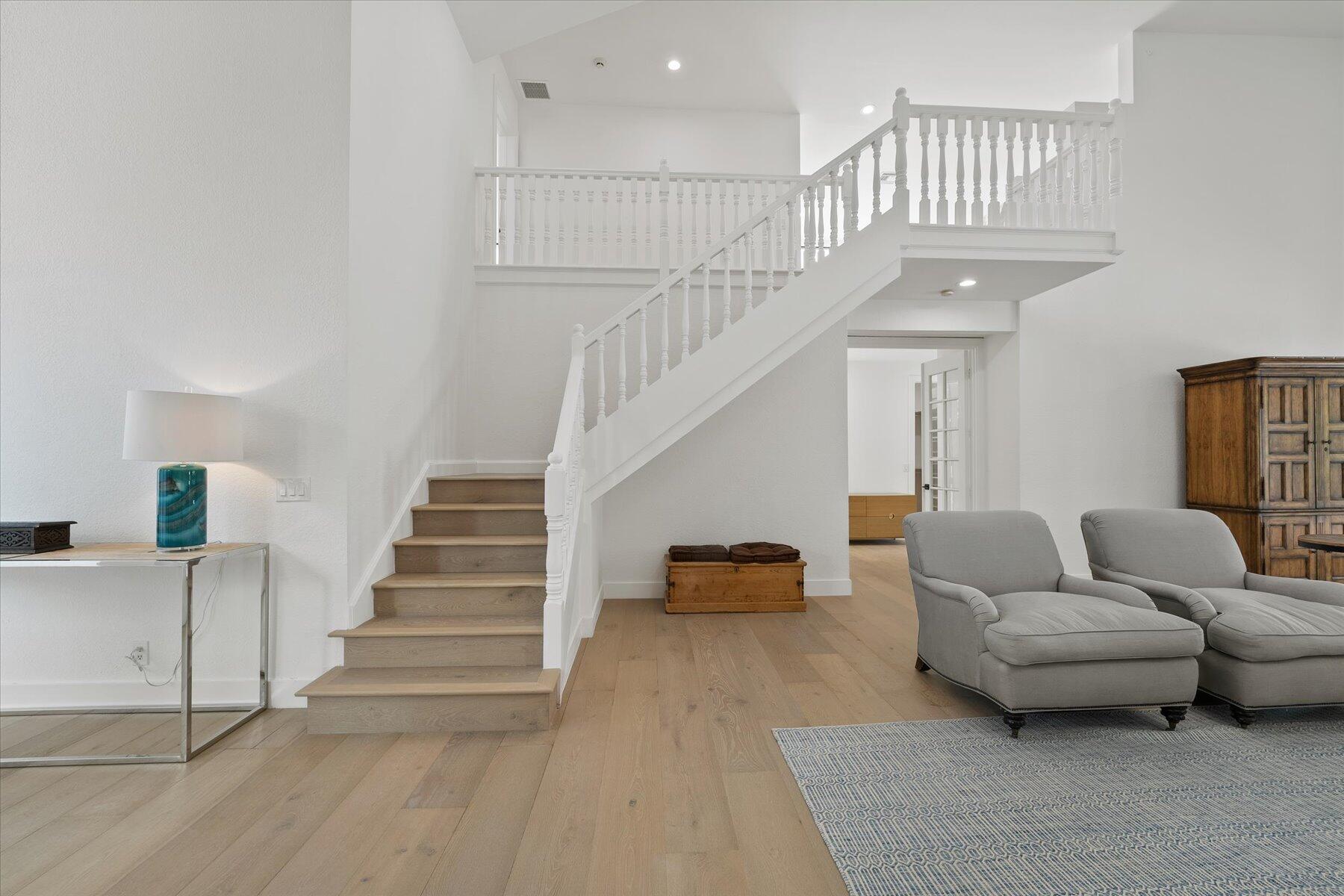 2821 Bent Cypress Road Wellington, FL 33414 - Photo 34 of 64 a living room with furniture and a chandelier