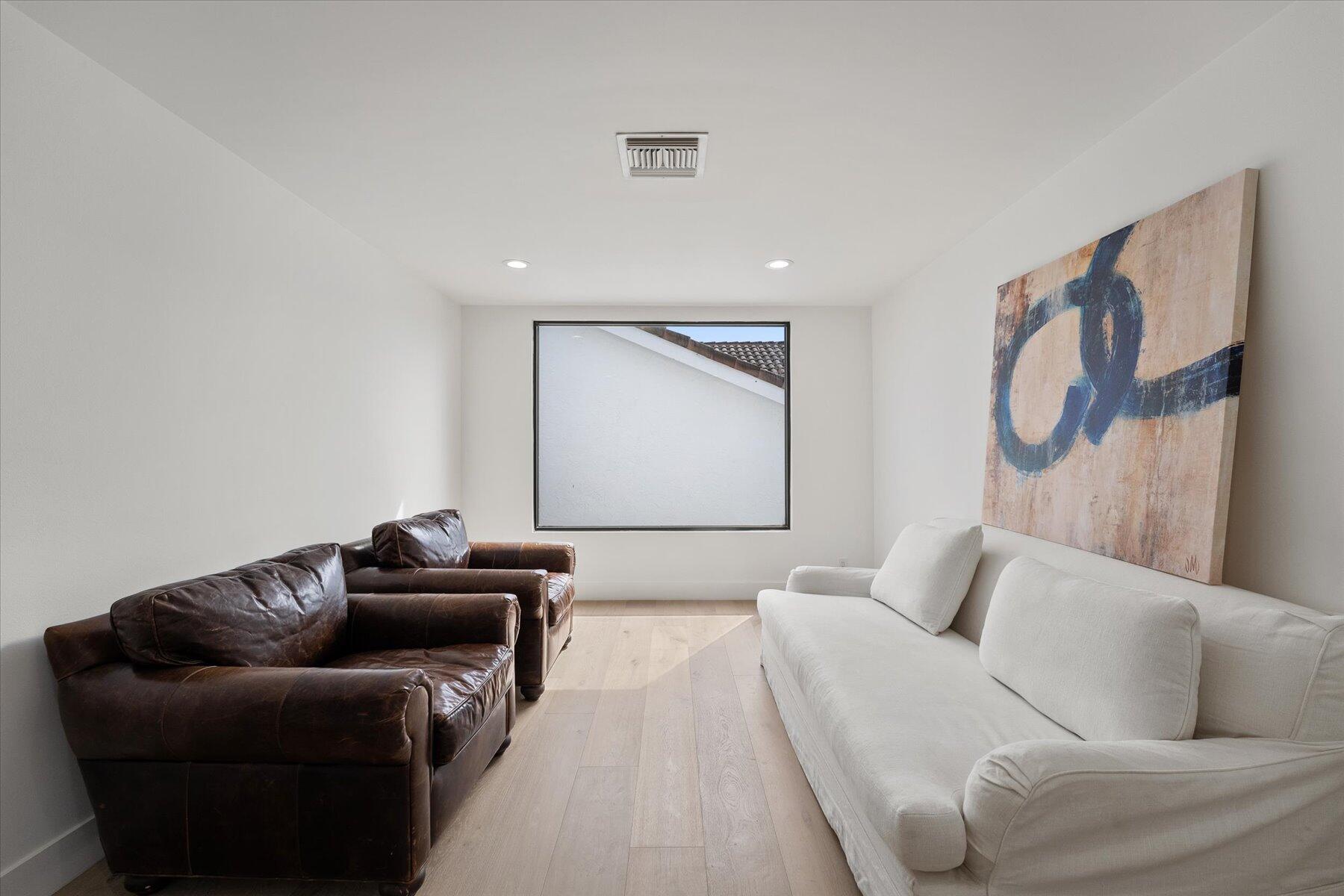 2821 Bent Cypress Road Wellington, FL 33414 - Photo 40 of 64 a living room with furniture and a couch