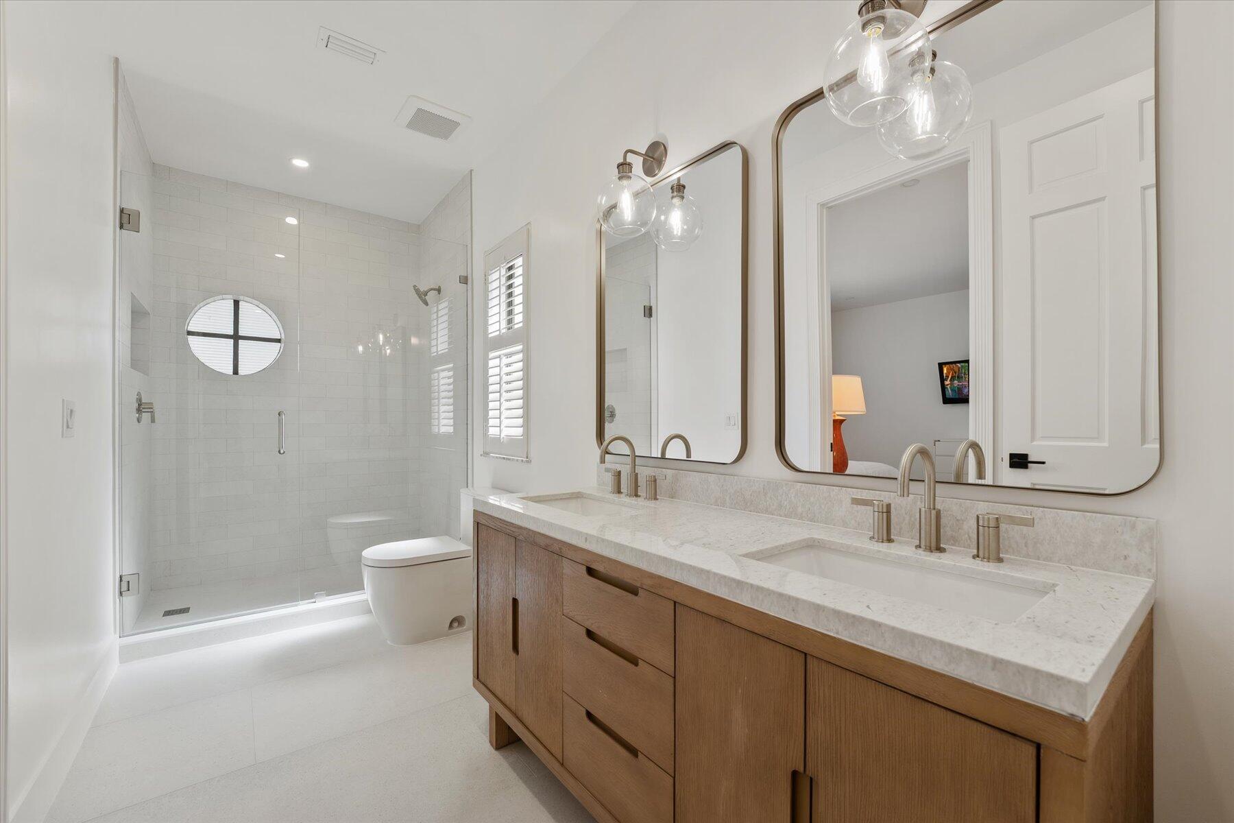 2821 Bent Cypress Road Wellington, FL 33414 - Photo 42 of 64 a bathroom with a sink a toilet and shower