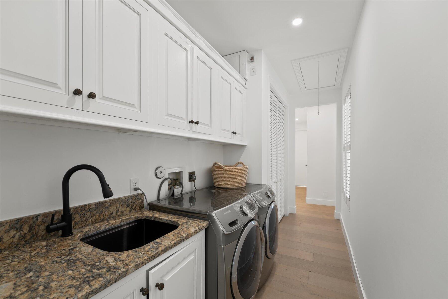 2821 Bent Cypress Road Wellington, FL 33414 - Photo 47 of 64 a kitchen with a sink a stove and cabinets