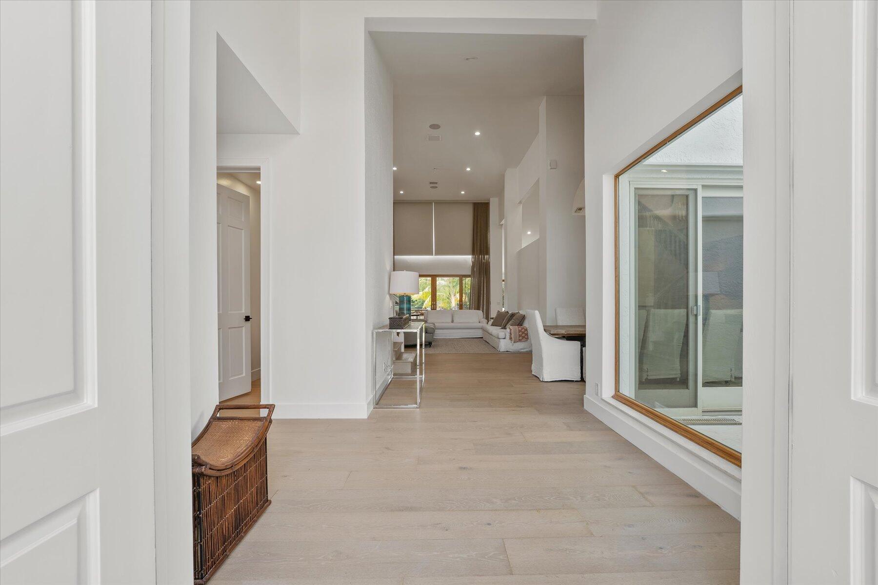 2821 Bent Cypress Road Wellington, FL 33414 - Photo 5 of 64 a view of a hallway with living room and furniture